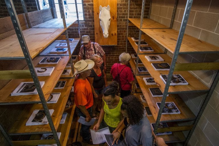 People standing between shelves at Iowa State Fairgrounds