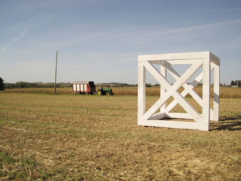 Prairie Module No. 3 in field with tractor in the background